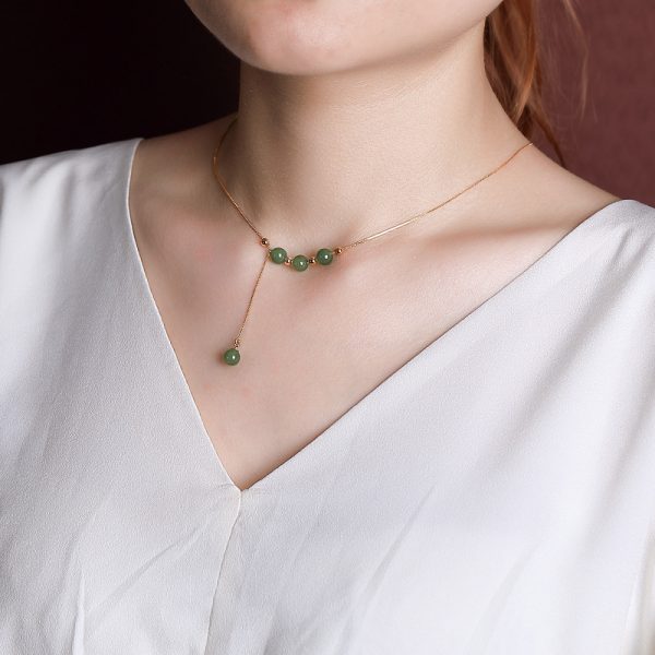 girl wearing hotan jade bead necklace