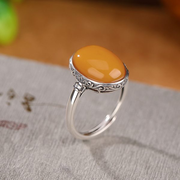 Sterling silver ring inlaid with egg yolk shaped beeswax