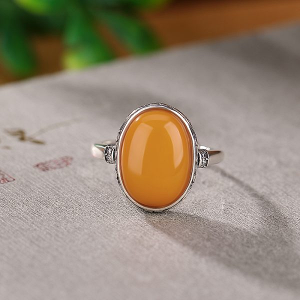 Sterling silver ring inlaid with egg yolk shaped beeswax