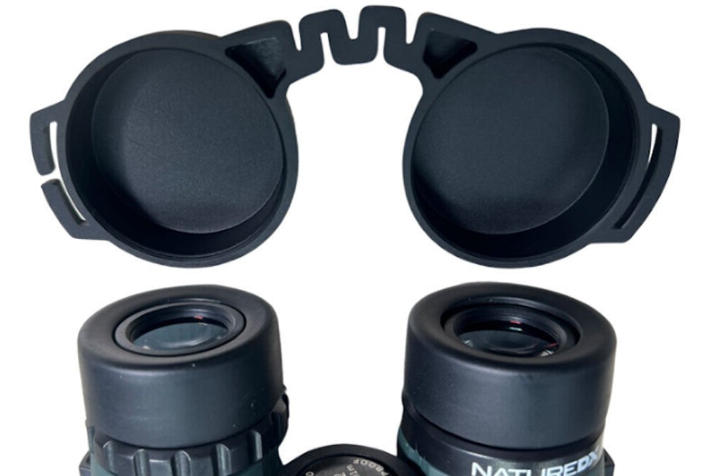 Celestron Nature DX 12×56 Binoculars come with two lens covers attached to the top of the eyecup to protect the BaK-4 glass